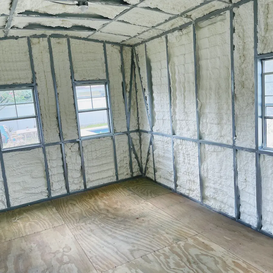 Closed-cell spray foam insulation applied to wall cavities in a residential project in Eldridge